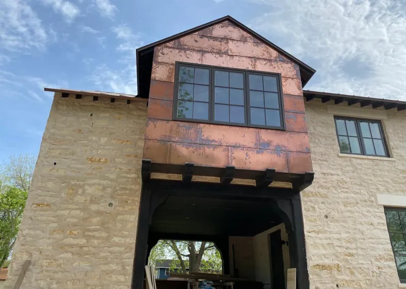Copper metal panel facade on a stone building for Metal Roof Coating in Shoreline